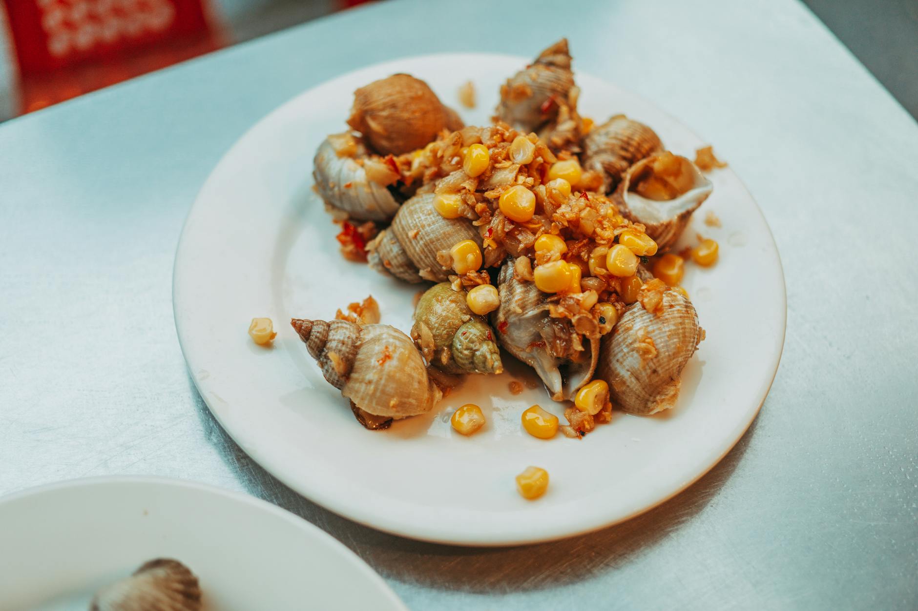 Cuisson bulots et tendreté : comprendre ce qui se joue dans la casserole — bulots cuits plat de fruits de mer